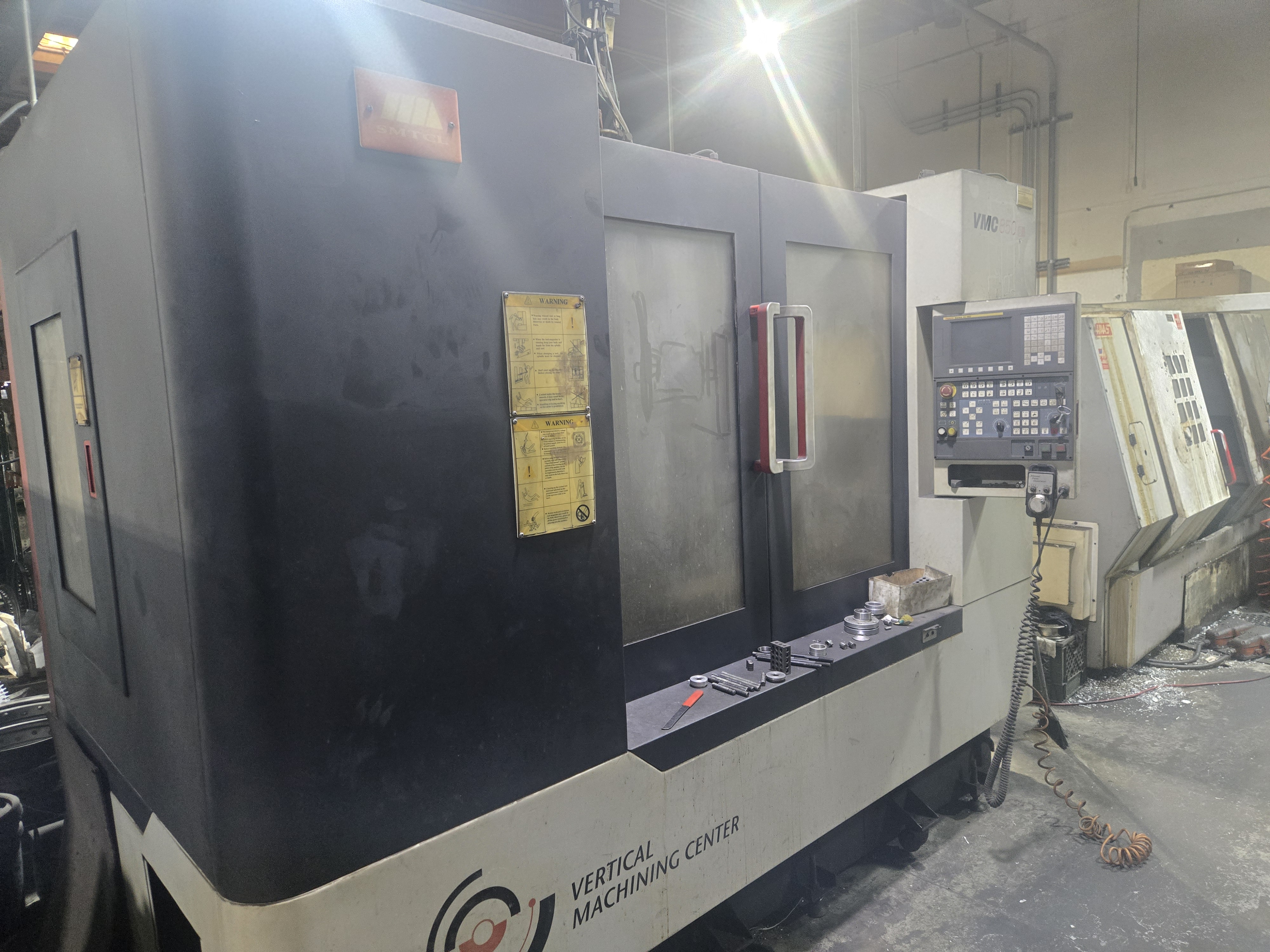 2011 SMTCL VMC 850B Vertical Machining Center – front doors and control