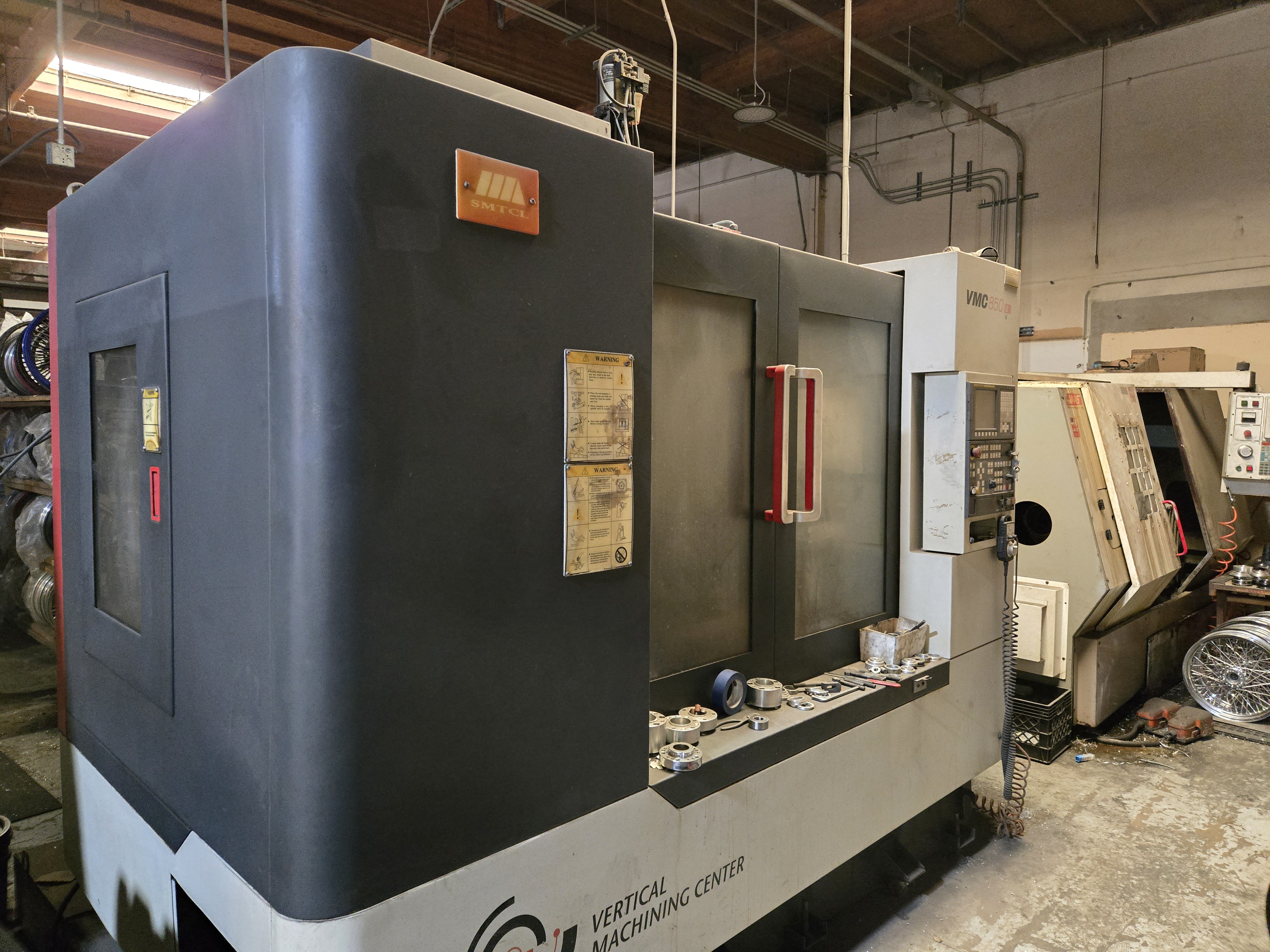 2011 SMTCL VMC 850B Vertical Machining Center – side view with control